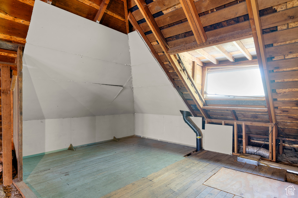 Bonus room featuring vaulted ceiling and hardwood / wood-style floors
