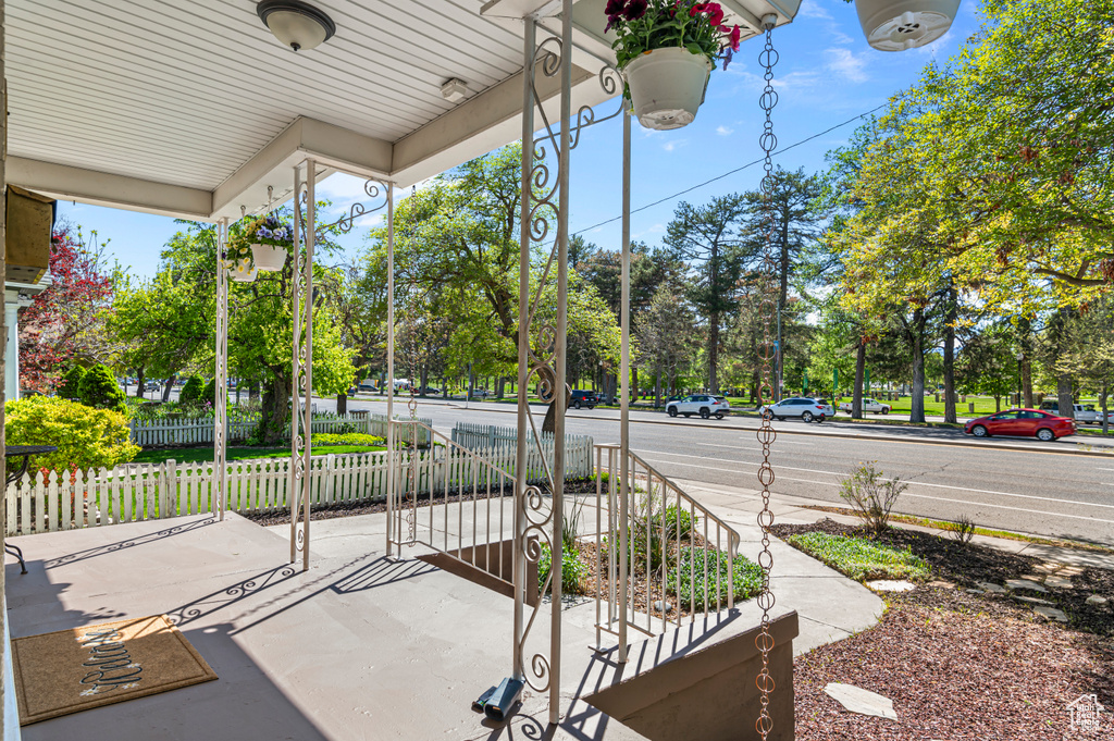View of patio / terrace featuring a porch and fence