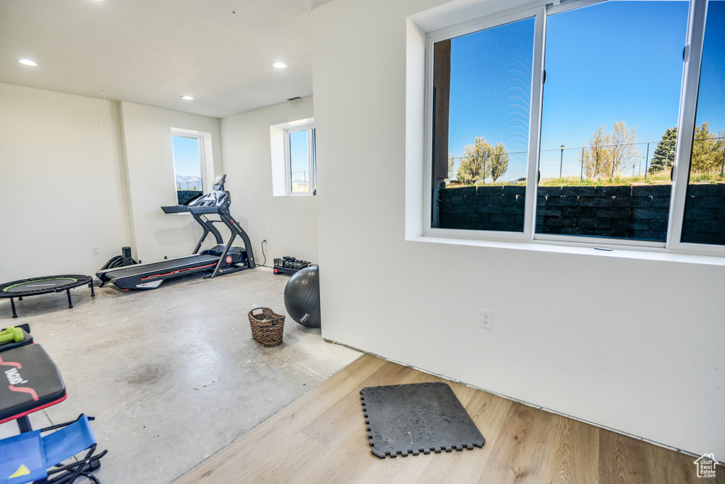 Exercise area with recessed lighting and wood finished floors
