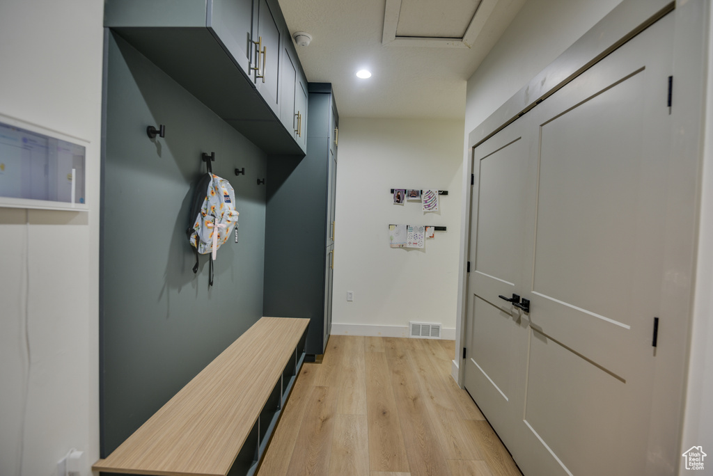 Mudroom with recessed lighting, baseboards, visible vents, and light wood-style flooring