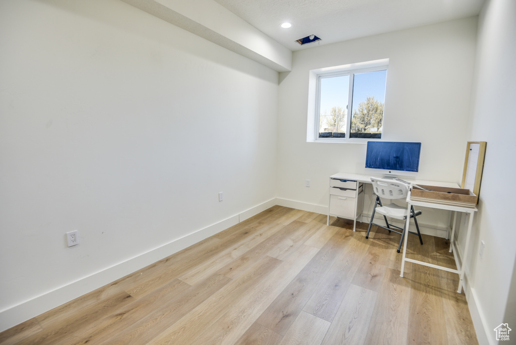 Office with recessed lighting, baseboards, and light wood finished floors