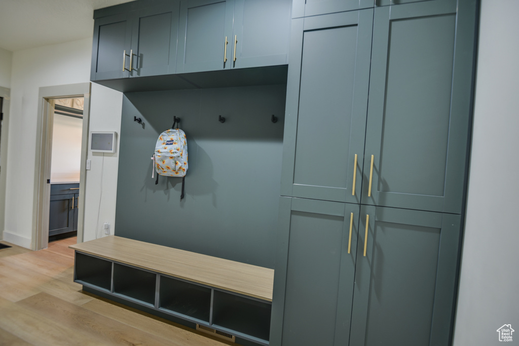 Mudroom with visible vents and light wood-style flooring