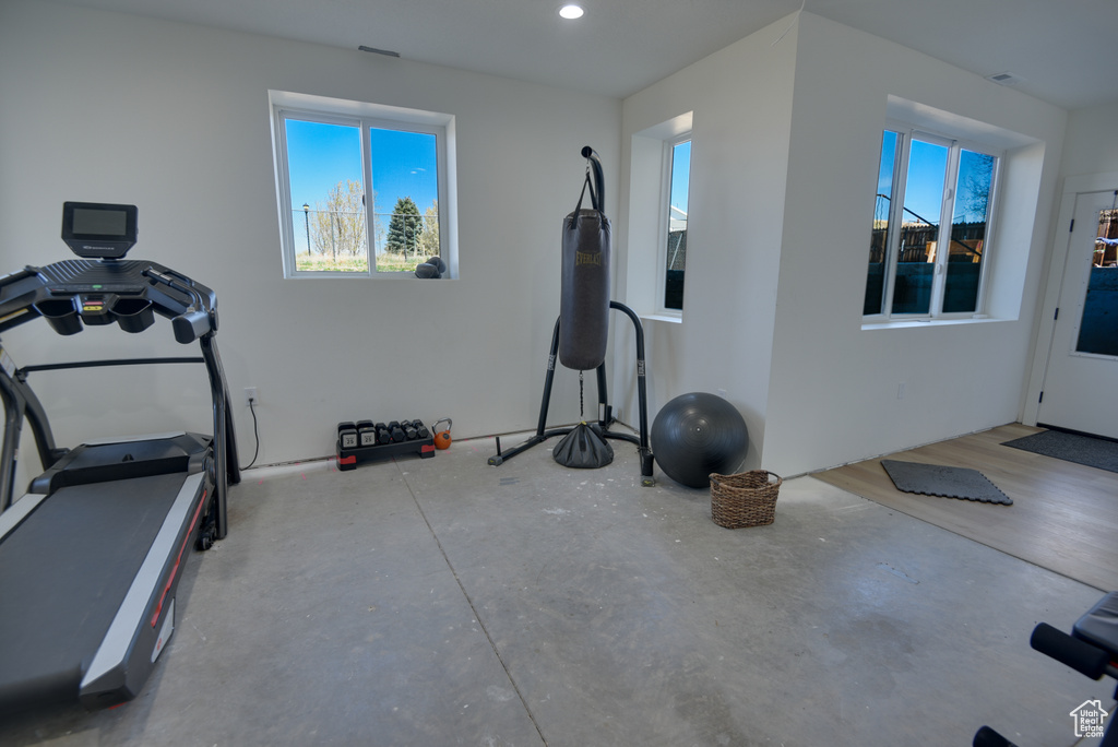 Exercise area with recessed lighting and a healthy amount of sunlight