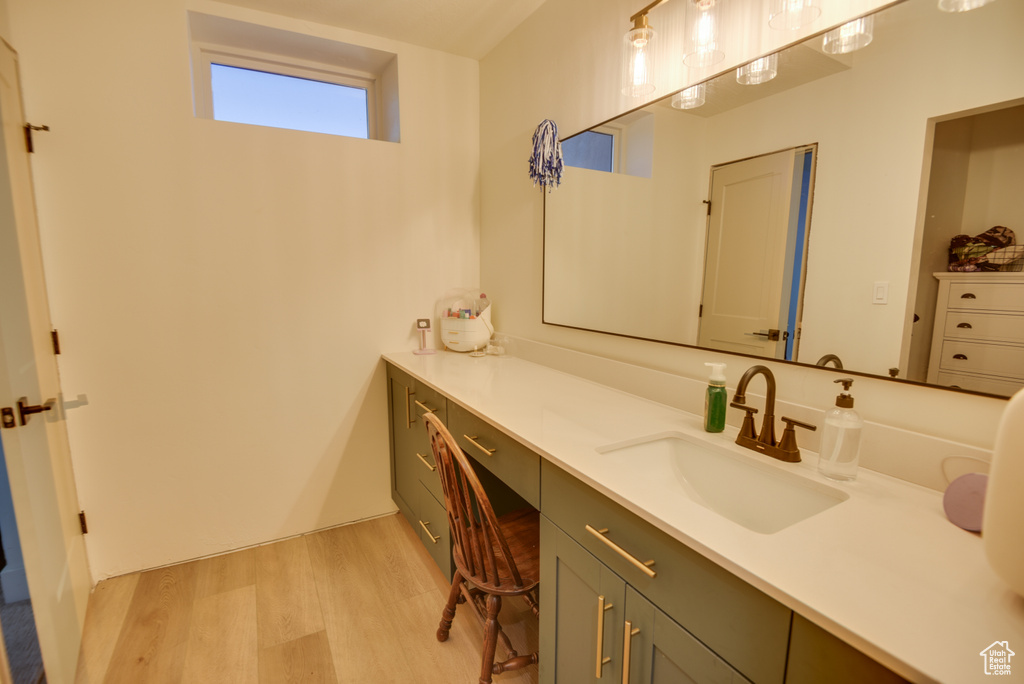 Bathroom with vanity and wood finished floors