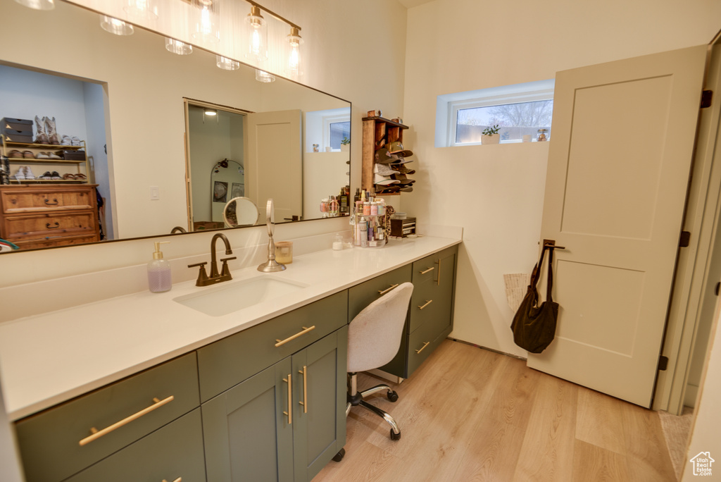 Bathroom with vanity and wood finished floors