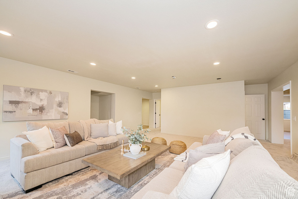 Living area featuring recessed lighting and visible vents