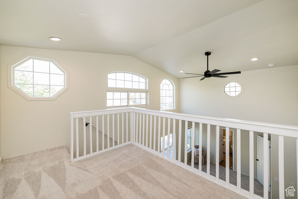 Hallway featuring carpet floors, recessed lighting, and lofted ceiling