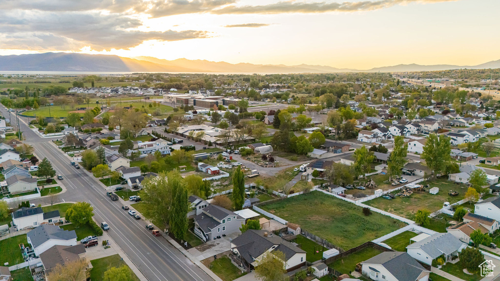 Aerial view at dusk with a residential view and a mountain view