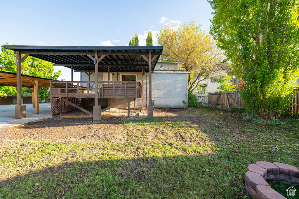 View of yard featuring fence and stairs