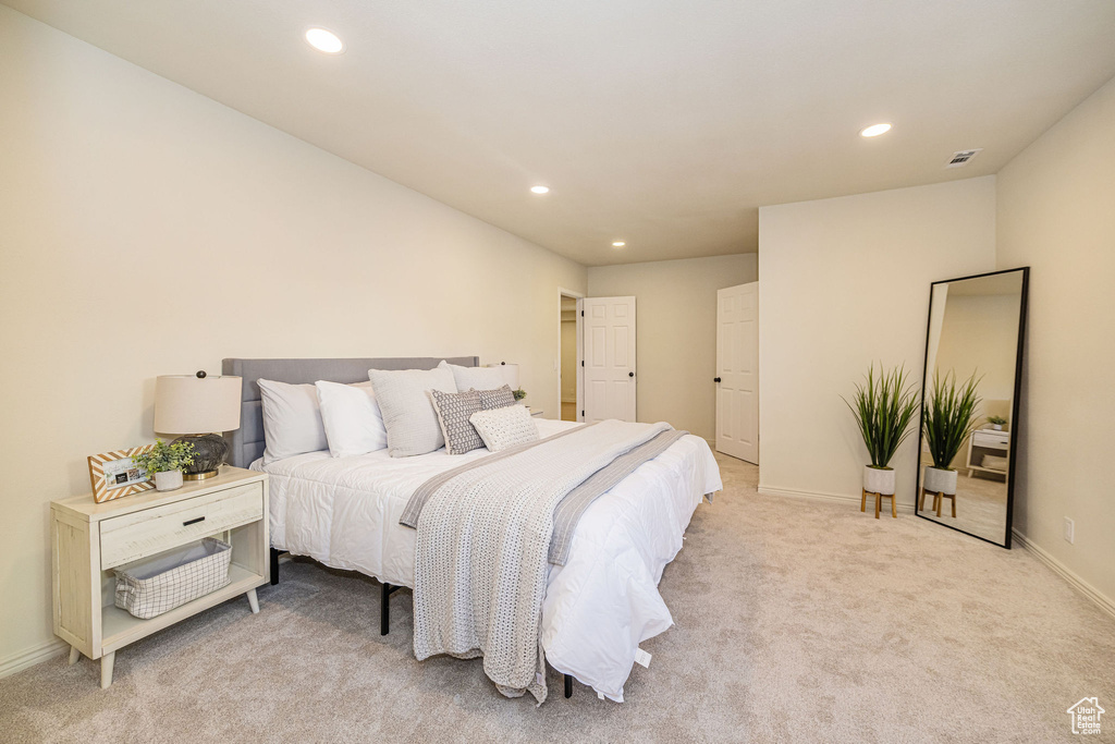 Bedroom featuring recessed lighting, baseboards, and light colored carpet