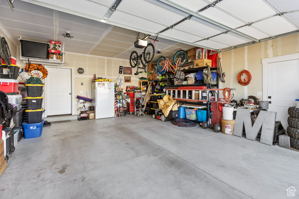 Garage featuring a garage door opener