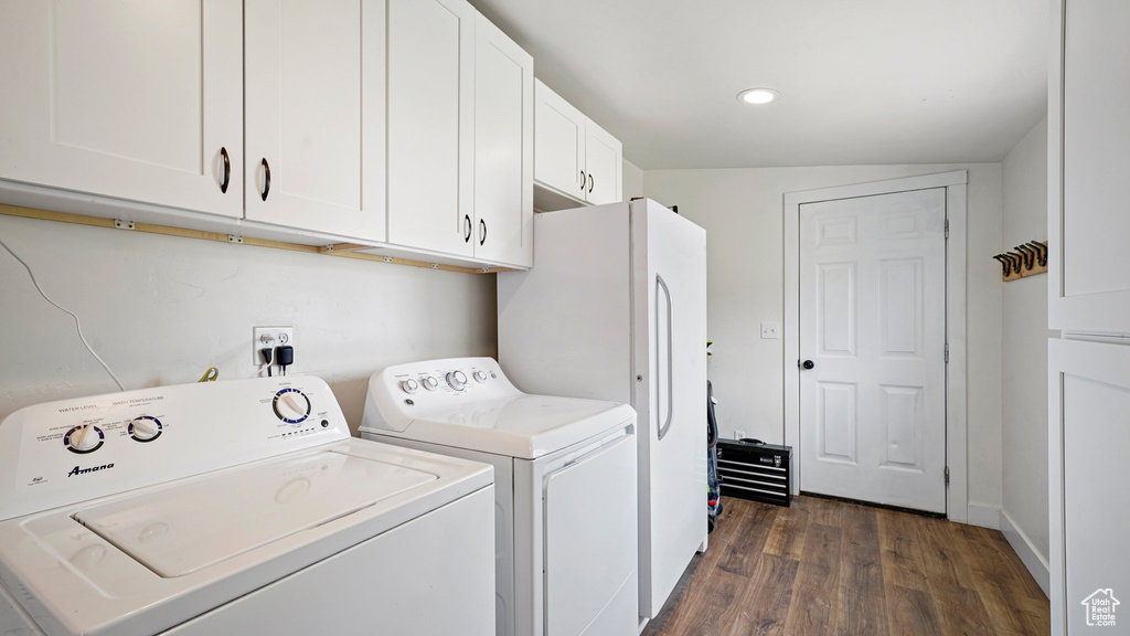 Laundry area with recessed lighting, cabinet space, dark wood-type flooring, and washing machine and dryer
