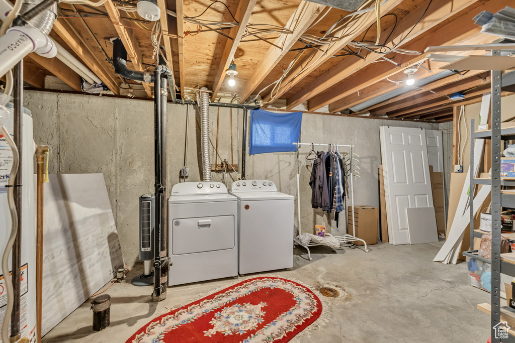 Unfinished below grade area with washer and dryer