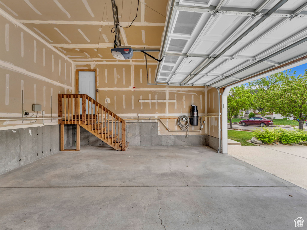 Garage featuring a garage door opener