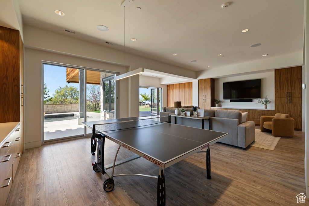 Rec room featuring wood finished floors and recessed lighting