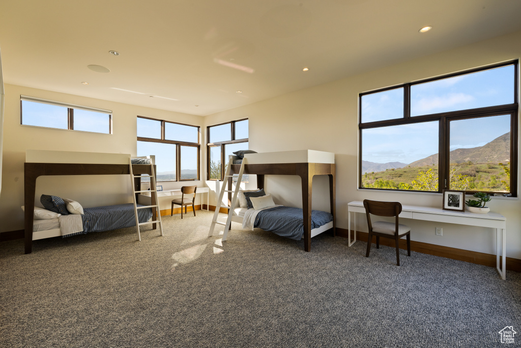 Bedroom with carpet, baseboards, a mountain view, and recessed lighting