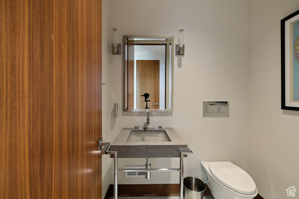 Half bathroom with a sink and toilet