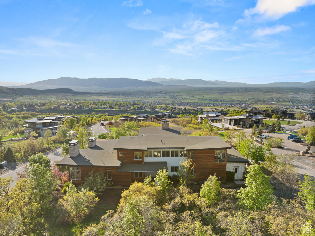 View from above of property with a mountain backdrop
