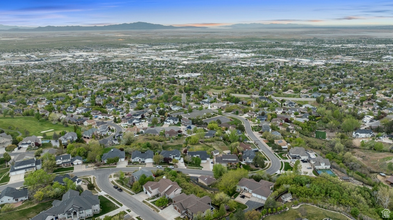 Birds eye view of property with a residential view and a mountain view