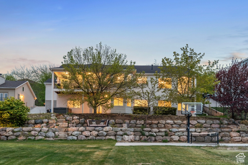 Exterior space with a lawn and stucco siding