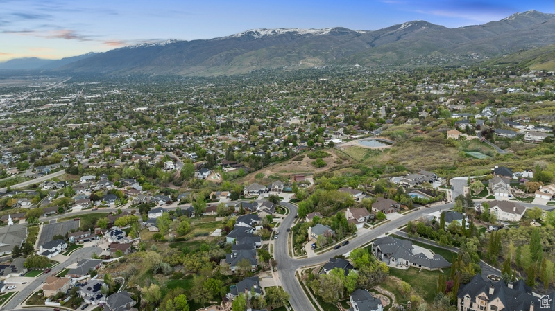 Birds eye view of property with a residential view and a mountain view