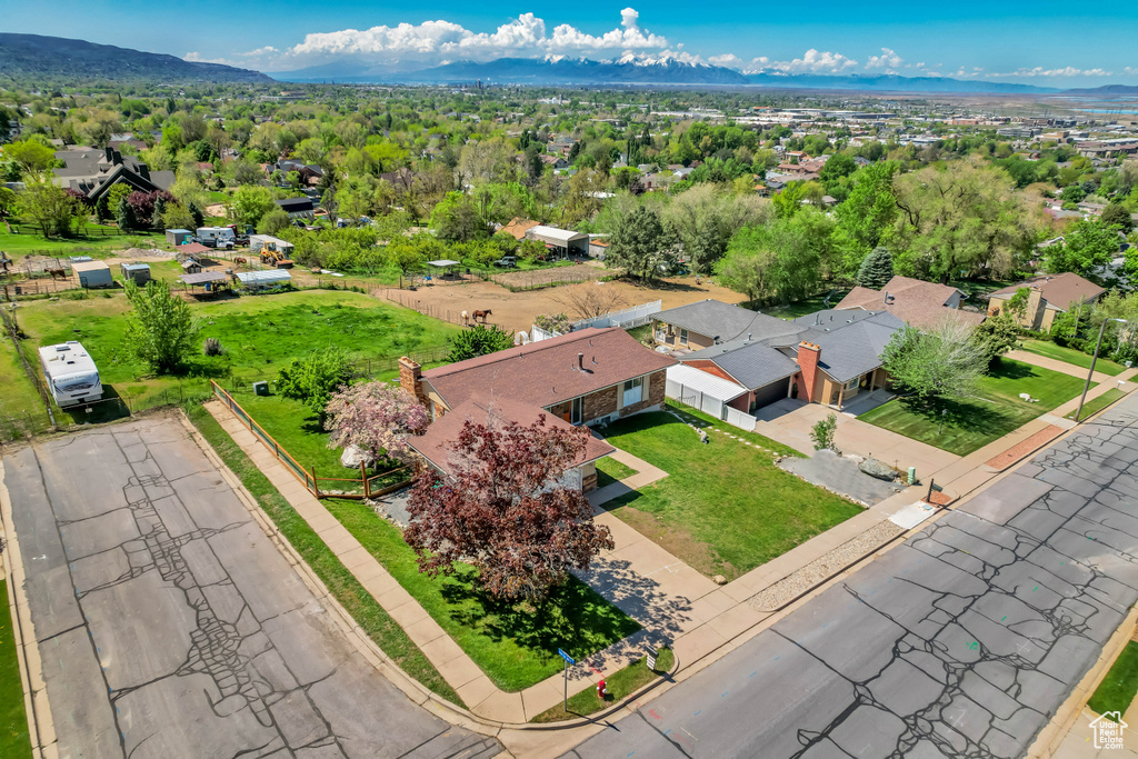 Birds eye view of property with a residential view and a mountain view
