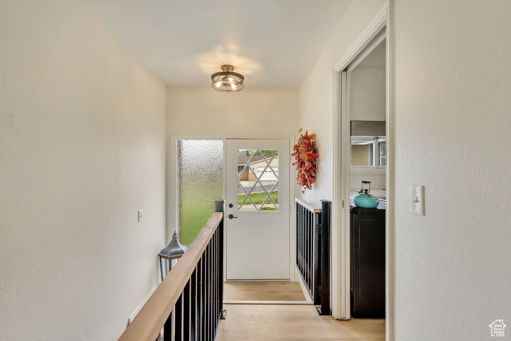 Corridor with light wood-style floors