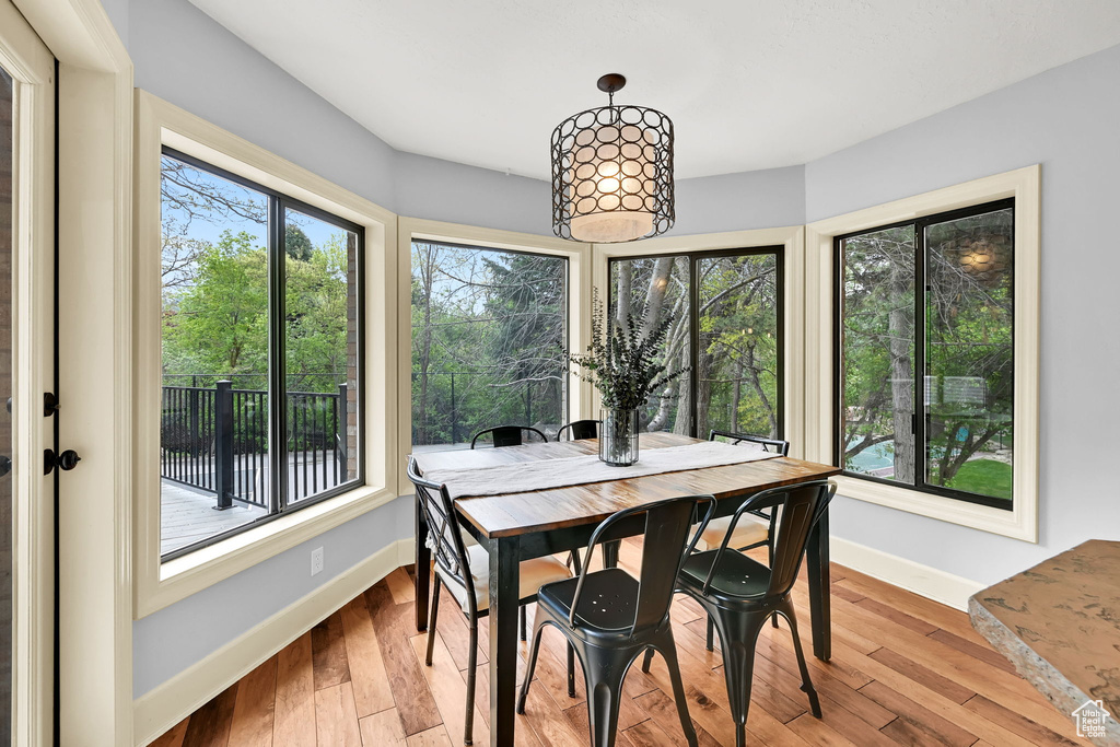 Dining room with baseboards and wood finished floors