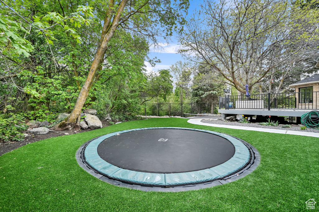 View of yard with a trampoline
