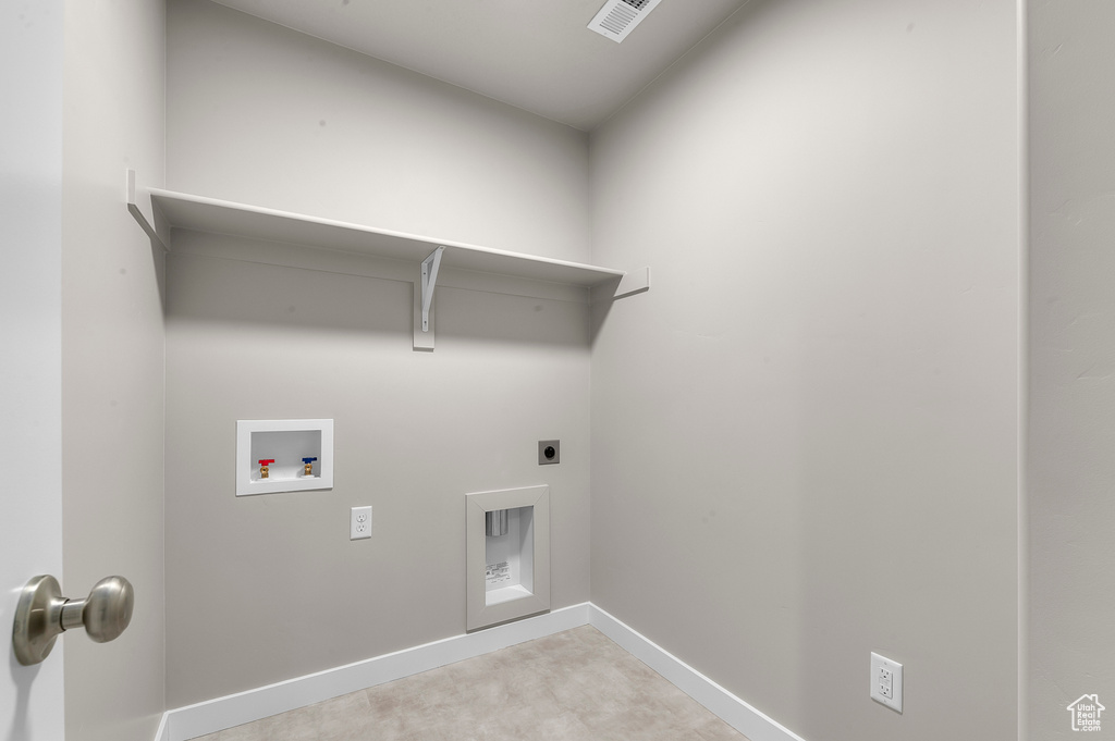 Laundry area with laundry area, visible vents, baseboards, hookup for a washing machine, and hookup for an electric dryer