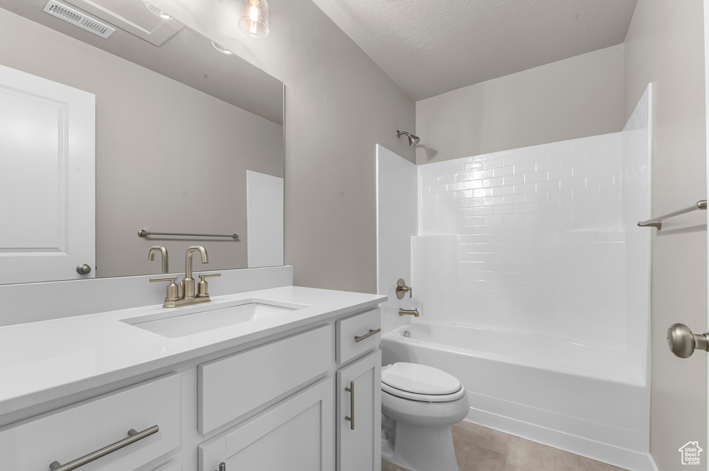 Full bath featuring visible vents, vanity, toilet, tile patterned floors, and  shower combination