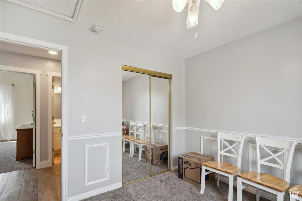 Rec room with a ceiling fan and wood finished floors