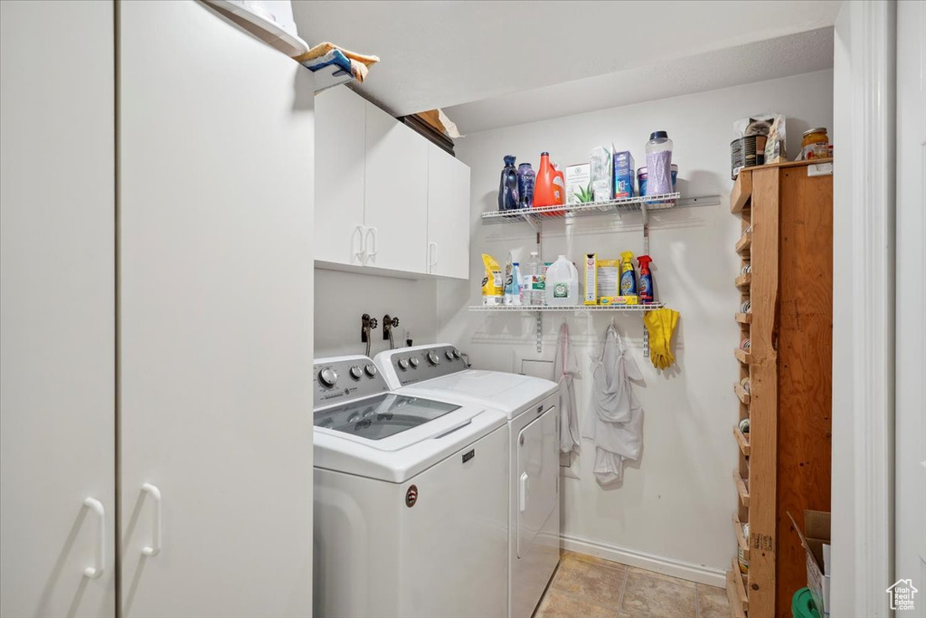 Washroom with independent washer and dryer and cabinet space