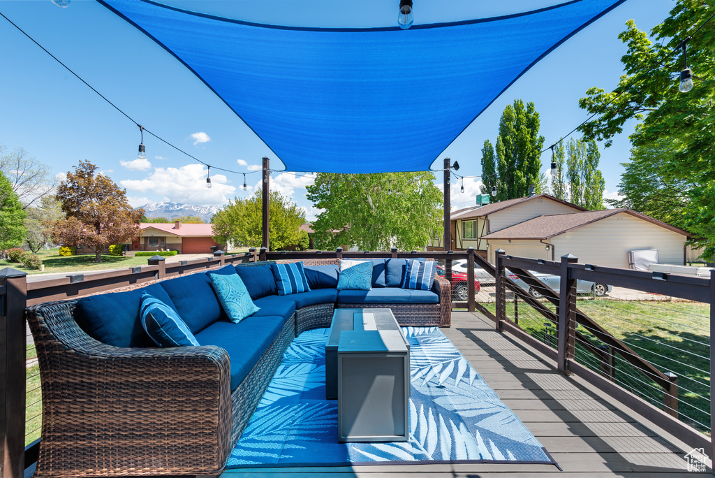 Wooden deck featuring outdoor lounge area
