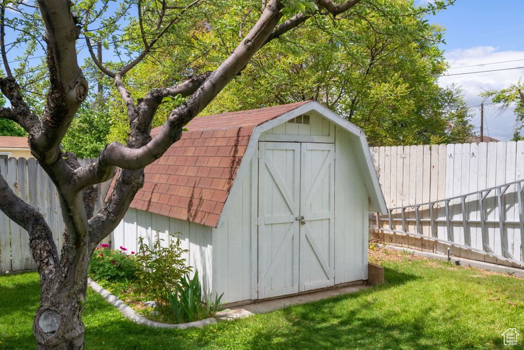 View of shed featuring a fenced backyard