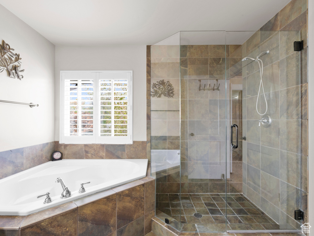 Full bath with a garden tub and a shower stall