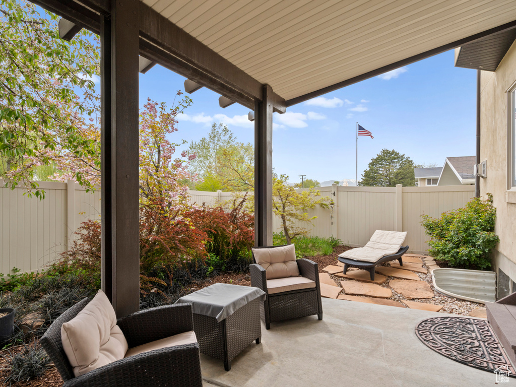 View of patio with a fenced backyard