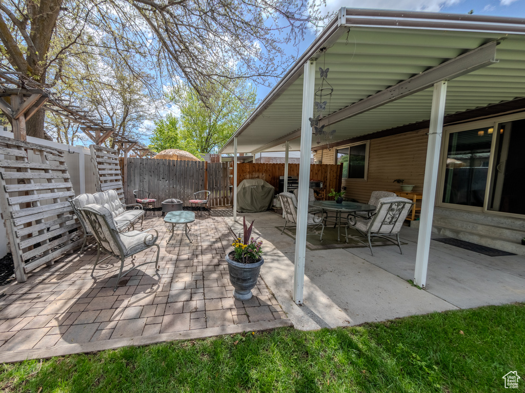 View of patio / terrace with a fenced backyard, outdoor dining space, and area for grilling