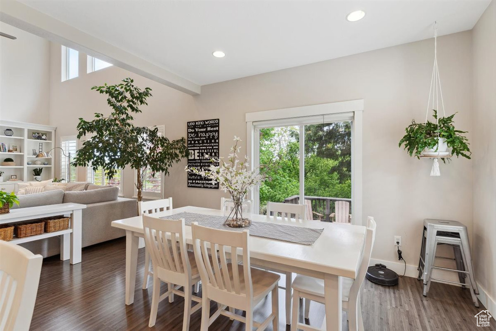 Dining space featuring baseboards, recessed lighting, and dark wood-style flooring