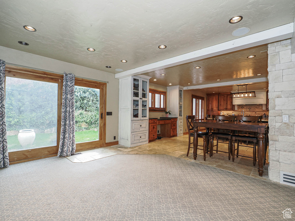 Interior space with recessed lighting and visible vents