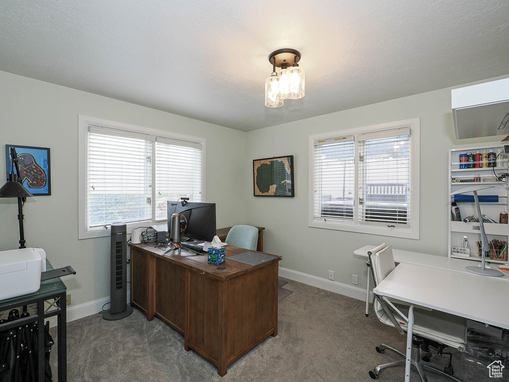 Carpeted office with baseboards
