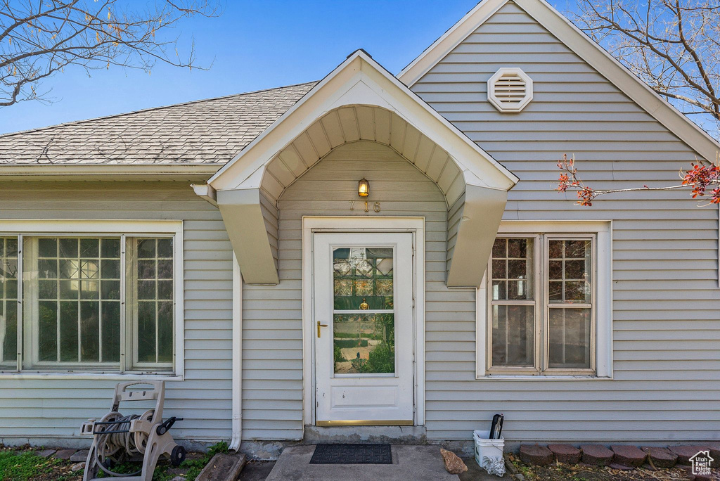 Property entrance with roof with shingles