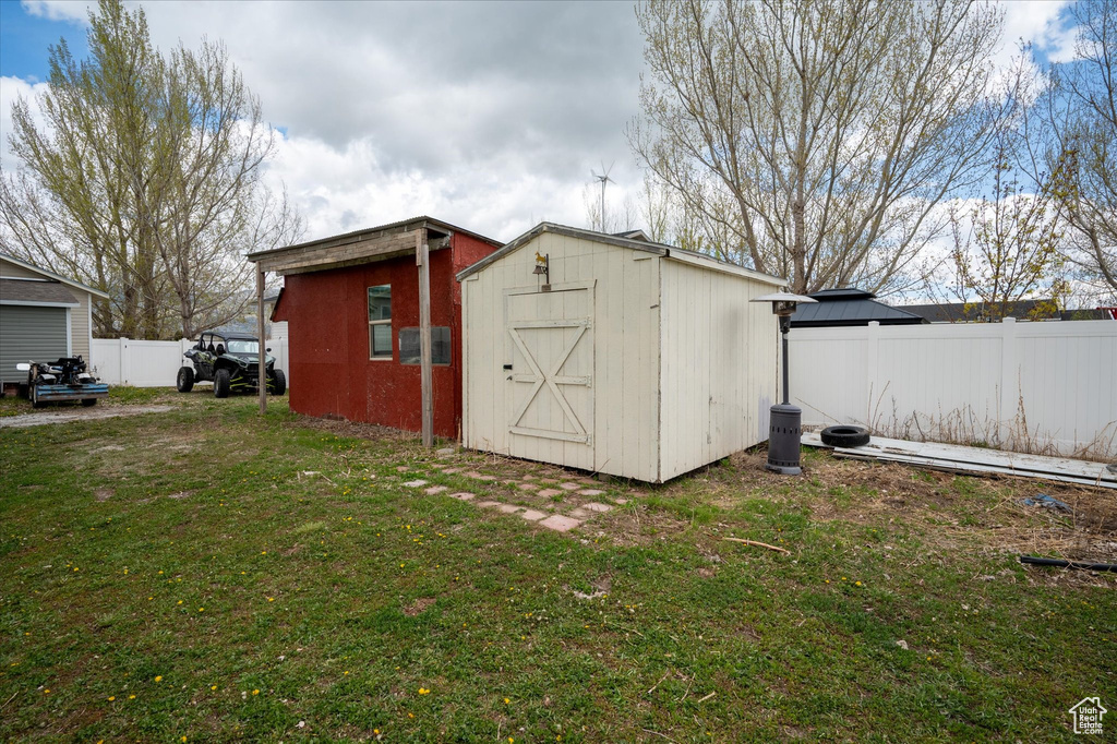 View of shed with fence