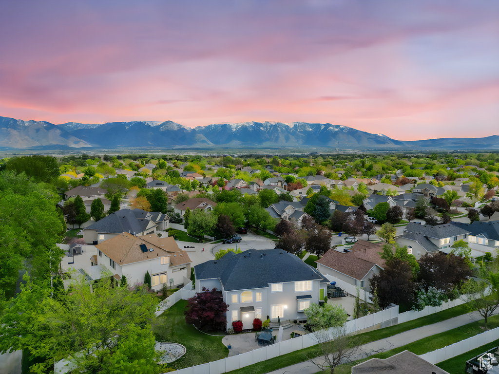 Aerial view at dusk with a residential view and a mountain view