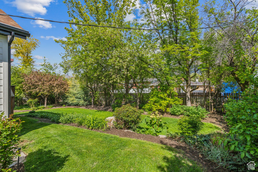 View of yard featuring fence