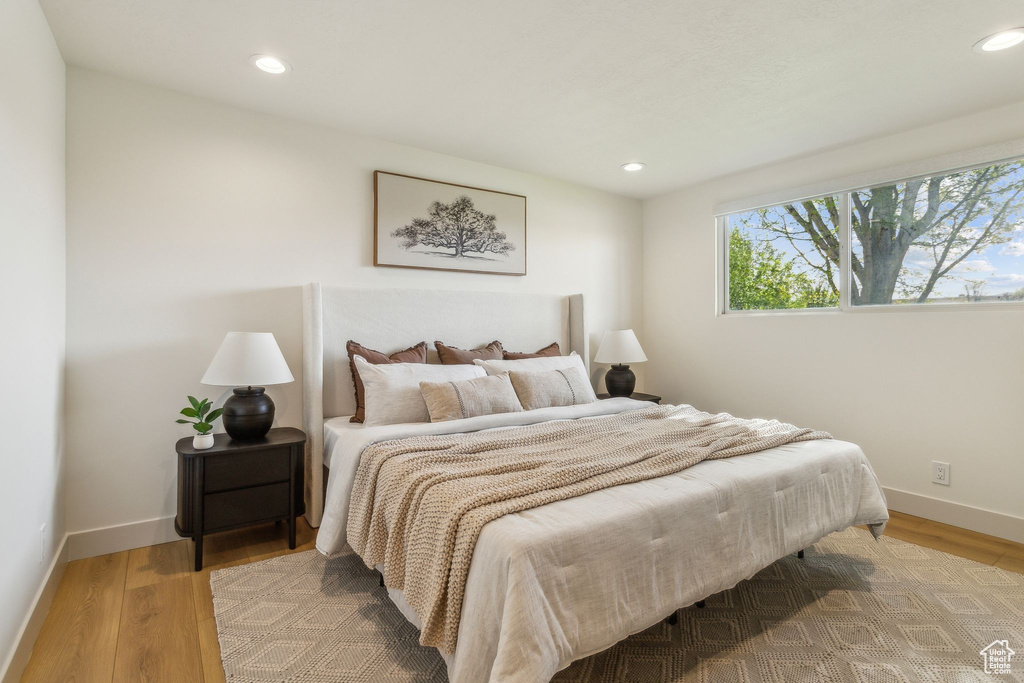 Bedroom with recessed lighting, baseboards, and light wood-type flooring