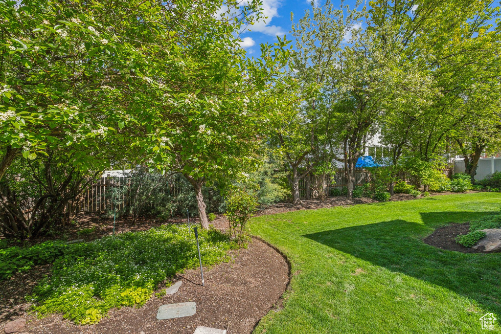 View of yard featuring fence