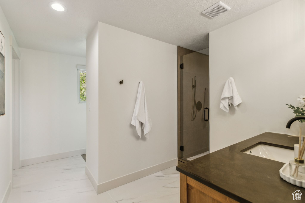 Full bathroom featuring visible vents, a shower stall, baseboards, marble finish floor, and recessed lighting