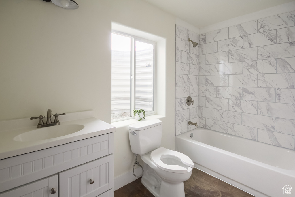 Full bath featuring toilet, tub / shower combination, and vanity