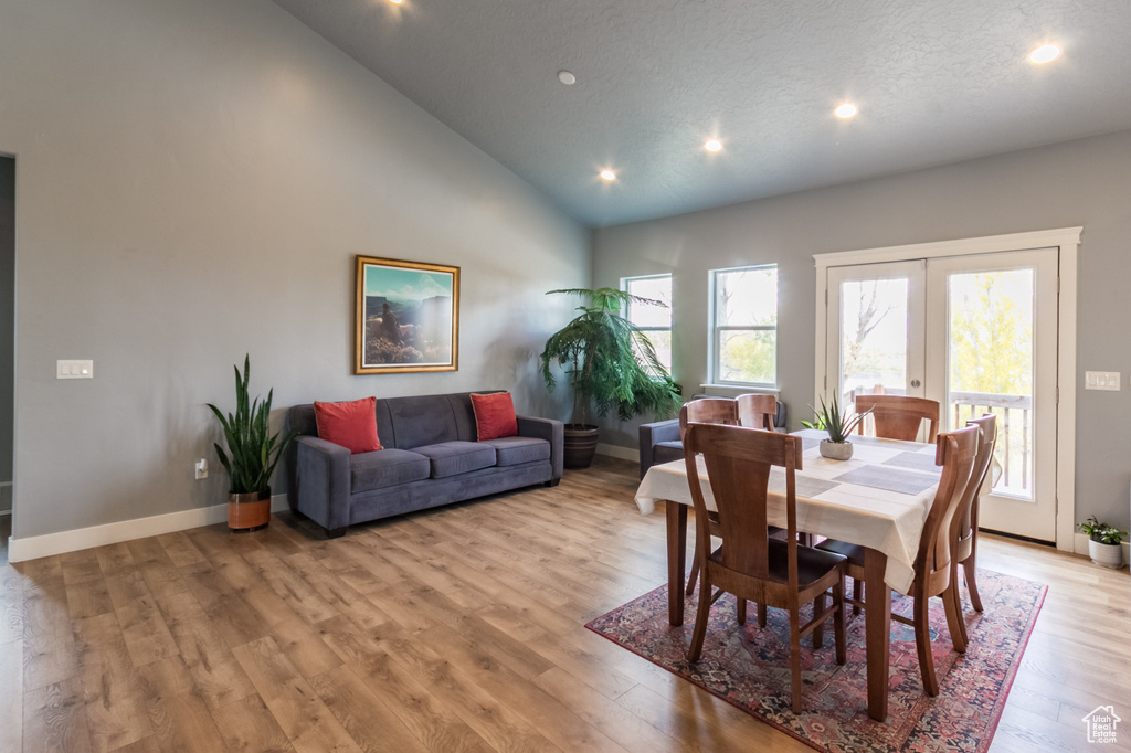 Dining space with recessed lighting, baseboards, plenty of natural light, and light wood finished floors